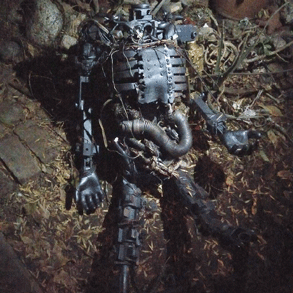 A used crash test dummy in a garden