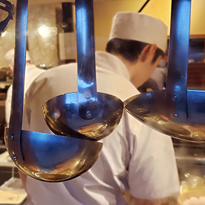 A chef makes a tasty meal in Osaka
